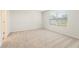 Well-lit bedroom with neutral walls and carpeted floors at 4171 Viola Pl, Atlanta, GA 30349