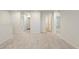 Bright hallway with multiple doors leading to bedrooms and a bathroom at 4171 Viola Pl, Atlanta, GA 30349