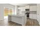 Modern kitchen with white cabinets, granite countertops, and an island at 4171 Viola Pl, Atlanta, GA 30349