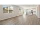 Open living space with hardwood floors and access to the kitchen and backyard at 4171 Viola Pl, Atlanta, GA 30349