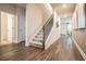 Light-filled foyer with hardwood floors and a modern staircase at 4171 Viola Pl, Atlanta, GA 30349