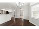 Kitchen dining area with hardwood floors and chandelier at 719 Oak Moss Dr, Lawrenceville, GA 30043