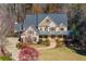 Aerial view of a brick house with a metal roof at 12695 Old Surrey Pl, Roswell, GA 30075