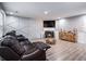 Finished basement with a fireplace and a modern wood accent wall at 6634 Pine Valley Trce, Stone Mountain, GA 30087
