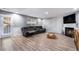 Finished basement with a fireplace, reclining sofa, and large TV at 6634 Pine Valley Trce, Stone Mountain, GA 30087
