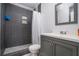 Updated bathroom with a gray tile shower and vanity at 6634 Pine Valley Trce, Stone Mountain, GA 30087