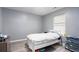 Bright bedroom with a full bed and window at 6634 Pine Valley Trce, Stone Mountain, GA 30087