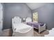 Charming bedroom with two twin beds and a window at 6634 Pine Valley Trce, Stone Mountain, GA 30087