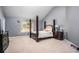 Spacious bedroom with a large four-poster bed and neutral decor at 6634 Pine Valley Trce, Stone Mountain, GA 30087