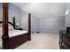 Main bedroom with a four-poster bed and built in shelving at 6634 Pine Valley Trce, Stone Mountain, GA 30087