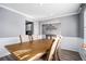 Bright dining room with hardwood floors and a wood table at 6634 Pine Valley Trce, Stone Mountain, GA 30087