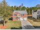 Brick two-story house with a two-car garage and basketball goal at 6634 Pine Valley Trce, Stone Mountain, GA 30087
