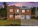 Brick two-story house with a two-car garage and a basketball goal at 6634 Pine Valley Trce, Stone Mountain, GA 30087