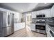 Modern kitchen with stainless steel appliances and granite countertops at 6634 Pine Valley Trce, Stone Mountain, GA 30087