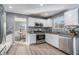 Modern kitchen with stainless steel appliances and granite countertops at 6634 Pine Valley Trce, Stone Mountain, GA 30087