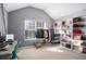 Home office with a built-in bookshelf and clothing rack at 6634 Pine Valley Trce, Stone Mountain, GA 30087