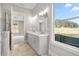 Double vanity bathroom with marble-look flooring and walk-in shower at 188 Vinca Nw Cir, Kennesaw, GA 30144