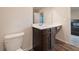 View of a bathroom vanity, toilet, and glimpse of the bedroom at 3530 Ridge Hill Pkwy, Douglasville, GA 30135