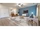 Living room with a blue accent wall, wood floors, and comfortable seating at 3530 Ridge Hill Pkwy, Douglasville, GA 30135