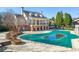 Community pool with covered patio and brickwork at 4950 Ivy Ridge Se Dr # 105, Atlanta, GA 30339