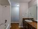 Bathroom with tub, shower, and vanity at 9887 Live Oak Ct, Douglasville, GA 30135