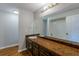 Double vanity bathroom with a large mirror at 9887 Live Oak Ct, Douglasville, GA 30135