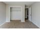 Bedroom with closet and access to hallway at 9887 Live Oak Ct, Douglasville, GA 30135