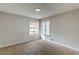 Bedroom with neutral walls and two windows at 9887 Live Oak Ct, Douglasville, GA 30135