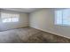 Spacious bedroom with neutral walls and brown carpet at 9887 Live Oak Ct, Douglasville, GA 30135