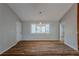Simple dining area with hardwood floors and a large window at 9887 Live Oak Ct, Douglasville, GA 30135