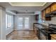 Eat-in kitchen with wood cabinets, stainless steel appliances, and vinyl flooring at 9887 Live Oak Ct, Douglasville, GA 30135