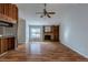 Living room with vaulted ceiling, stone fireplace, and wood flooring at 9887 Live Oak Ct, Douglasville, GA 30135
