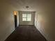 Simple dining room with carpeted floors and a window at 470 Pineland Sw Rd, Mableton, GA 30126