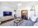 Living room with hardwood floors, fireplace, and a cozy sitting area at 361 Glenwood Se Ave, Atlanta, GA 30312