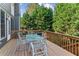 Spacious deck with table and chairs, perfect for outdoor dining and entertaining at 4695 Prestbury Dr, Suwanee, GA 30024