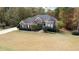 Brick house with gray roof, large yard, and driveway at 3771 Mason Ridge Dr, Winston, GA 30187