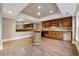 Wet bar in the basement with wood cabinets at 2195 Lake Shore Lndg, Alpharetta, GA 30005