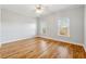 Bright bedroom with hardwood floors and large windows at 2195 Lake Shore Lndg, Alpharetta, GA 30005