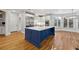 Modern kitchen with large island, stainless steel appliances, and hardwood floors at 2195 Lake Shore Lndg, Alpharetta, GA 30005