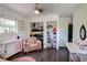 Well-lit bedroom with hardwood floors and generous closet storage at 4246 Antler Se Trl, Smyrna, GA 30082