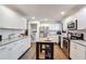 Updated kitchen featuring white cabinets, granite countertops, and stainless steel appliances at 4246 Antler Se Trl, Smyrna, GA 30082