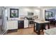 Kitchen with white cabinets, granite countertops, and island at 4246 Antler Se Trl, Smyrna, GA 30082