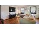 Living room with hardwood floors, sectional sofa, and large TV at 4246 Antler Se Trl, Smyrna, GA 30082