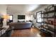 Living room with hardwood floors, sectional sofa, and bookshelf at 4246 Antler Se Trl, Smyrna, GA 30082
