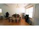 Dining room with hardwood floors and a chandelier at 11854 Registry Blvd, Hampton, GA 30228