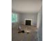 Living room with hardwood floors and a fireplace; currently under renovation at 5621 Zanola Sw Dr, Mableton, GA 30126
