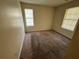 Bright bedroom with neutral walls and wall-to-wall carpeting at 5750 Old Carriage Dr, Atlanta, GA 30349