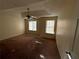 Spacious bedroom with carpeted floors and ceiling fan at 5750 Old Carriage Dr, Atlanta, GA 30349