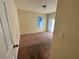 Simple bedroom with carpeted floors and a window at 5750 Old Carriage Dr, Atlanta, GA 30349
