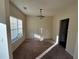 Simple dining room with neutral walls and carpeting at 5750 Old Carriage Dr, Atlanta, GA 30349